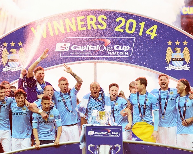 Manchester City players celebrate victory.