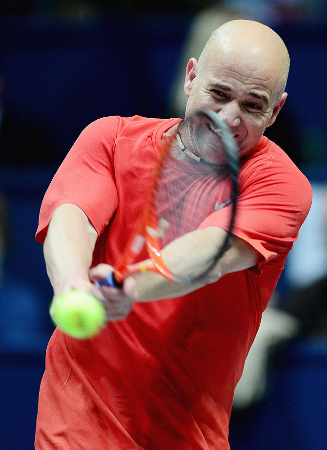 Andre Agassi in action against Pete Sampras in the exhibition match during the World Tennis Day London Showdown at the Athenaeum Hotel at Piccadilly on Monday