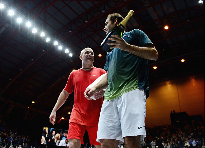 Andre Agassi and Pete Sampras after their match during the World Tennis Day London Showdown on Monday