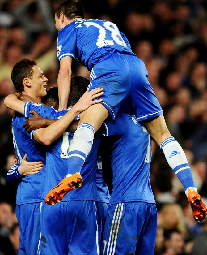 Eden Hazard of Chelsea celebrates with teammates after scoring.
