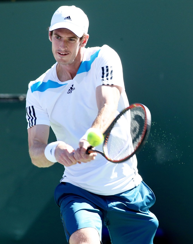 Andy Murray of Great Britain hits a return.