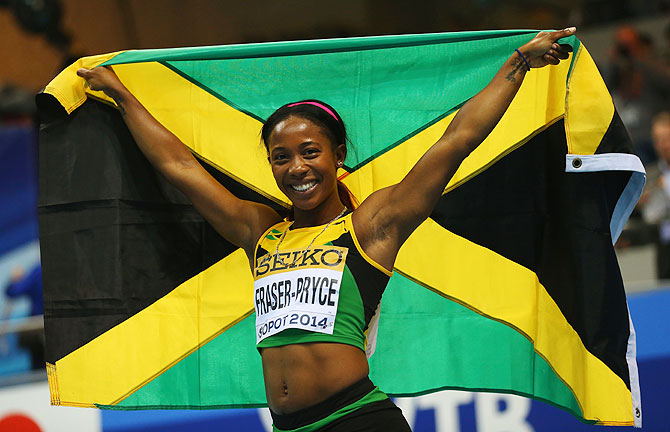 Shelly-Ann Fraser-Pryce of Jamaica celebrates winning the gold medal in the Women's 60m final during day three of the IAAF World Indoor Championships at Ergo Arena on in Sopot, Poland on Sunday
