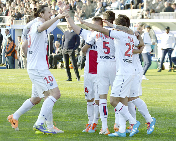 Paris Saint-Germain's Zlatan Ibrahimovic (left) celebrates with teammates after scoring