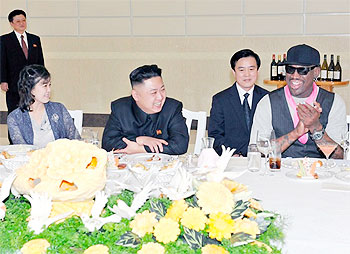 Kim Jong-Un, his wife Ri Sol-Ju and former NBA basketball player Dennis Rodman talk in Pyongyang