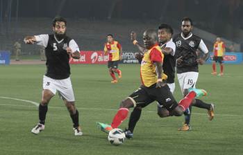 East Bengal's Chidi Edeh is tackled by a host of Mohammedan Sporting defenders as he breaks into the box