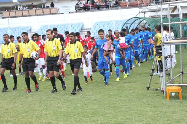 Sunil Chhetri (right) leads the Indian squad out against Bangladesh
