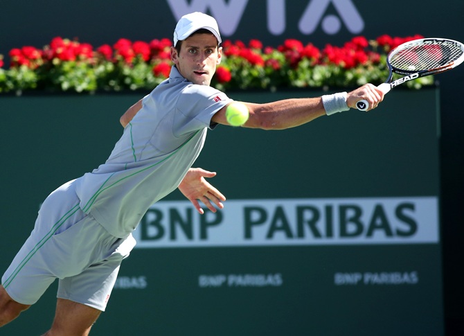 Novak Djokovic of Serbia hits a return