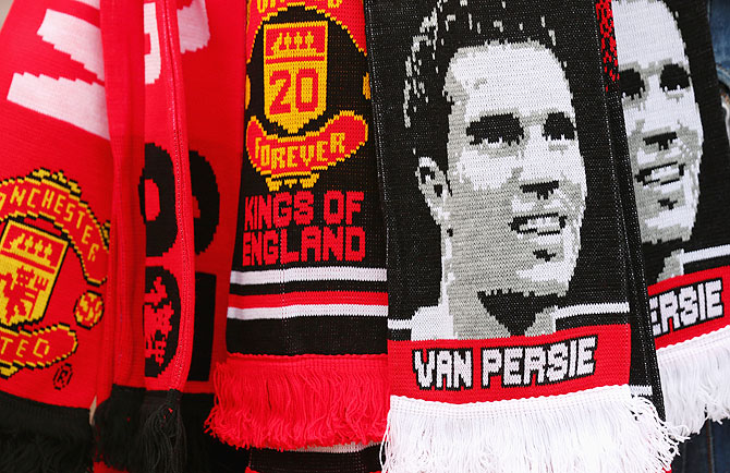 Manchester United scarves on sale at a merchandise stall 