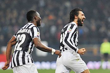 Andrea Pirlo (R) of Juventus celebrates after scoring the opening goal during their Serie A match against Genoa on Sunday