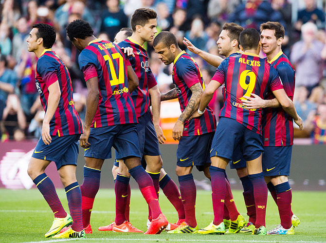 FC Barcelona players celebrate after scoring a goal