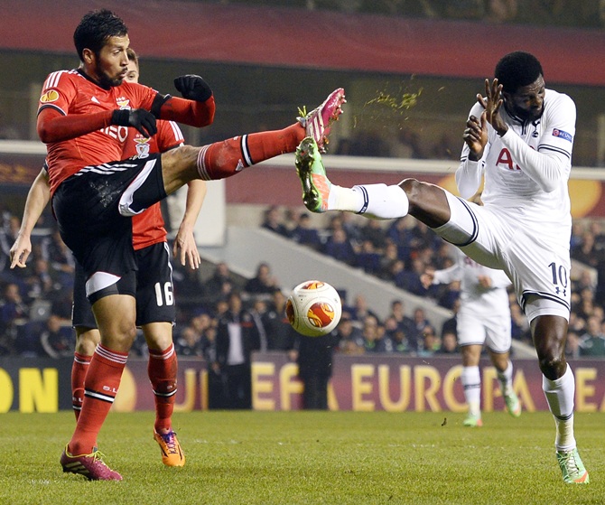 Tottenham Hotspur's Emmanuel Adebayor challenges Benfica's Ezekiel Garay