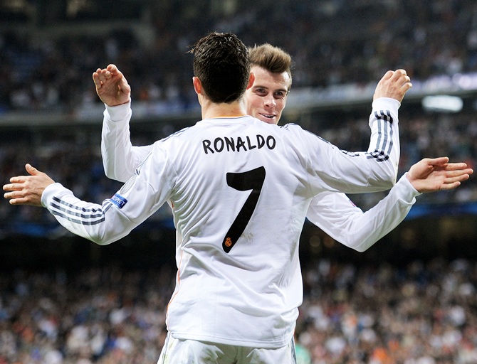 Cristiano Ronaldo of Real Madrid celebrates with teammate Gareth Bale