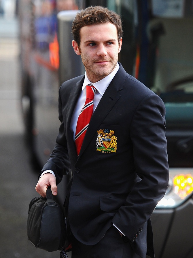 Juan Mata of Manchester United steps off the team bus