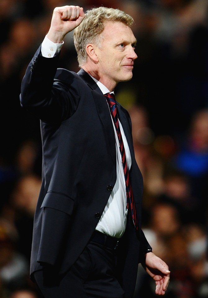 Manchester United Manager David Moyes celebrates at the end   of the UEFA Champions League Round of 16 second round match against Olympiacos FC at Old Trafford