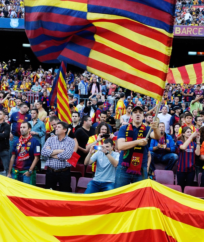 FC Barcelona supporters cheer their team during a La Liga match