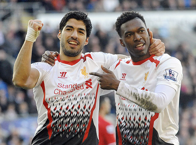 Liverpool's Daniel Sturridge (right) celebrates with Luis Suarez after scoring against Cardiff City on Saturday