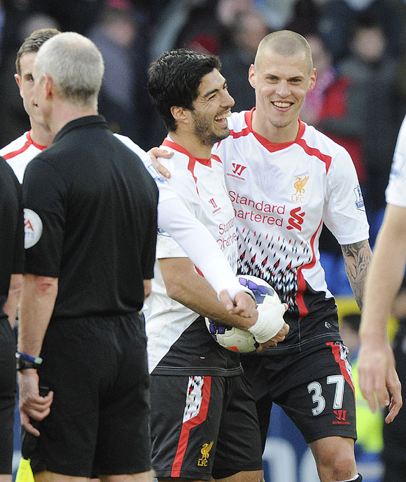 Liverpool's Luis Suarez (left)celebrates with Martin Skrtel