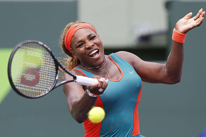 Serena Williams hits a forehand against Caroline Garcia