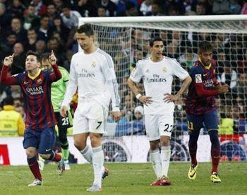 Barcelona's Lionel Messi (left) and Neymar (right) celebrate a goal as  Real Madrid's Cristiano Ronaldo (second left) and Angel Di Maria (second right) walk back during La Liga's second ''Clasico'' match of the season at Santiago Bernabeu stadium in Madrid.