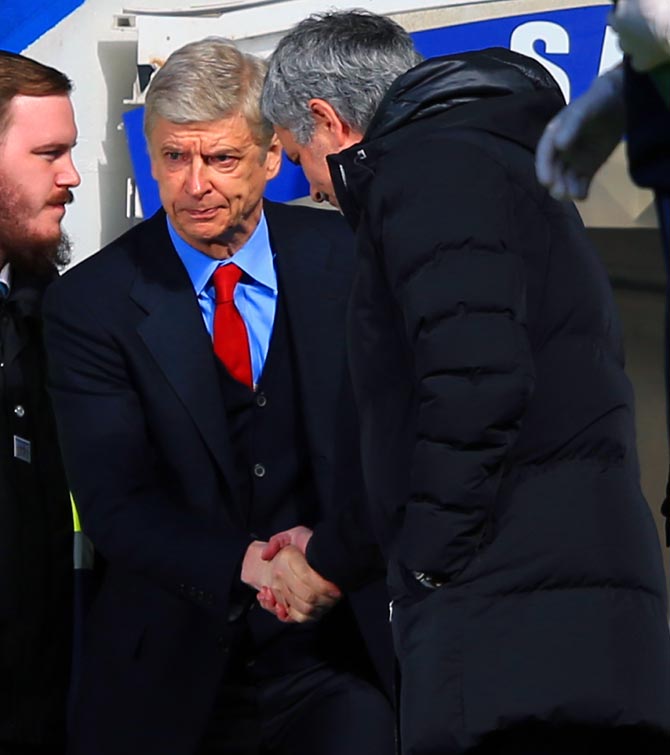 Chelsea manager Jose Mourinho, right, greets Arsenal manager Arsene Wenger