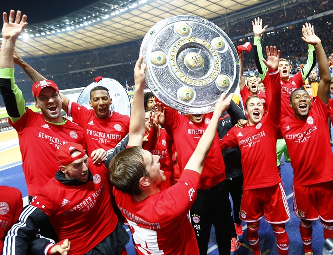 Bayern Munich's players celebrate with mock German soccer championship trophies