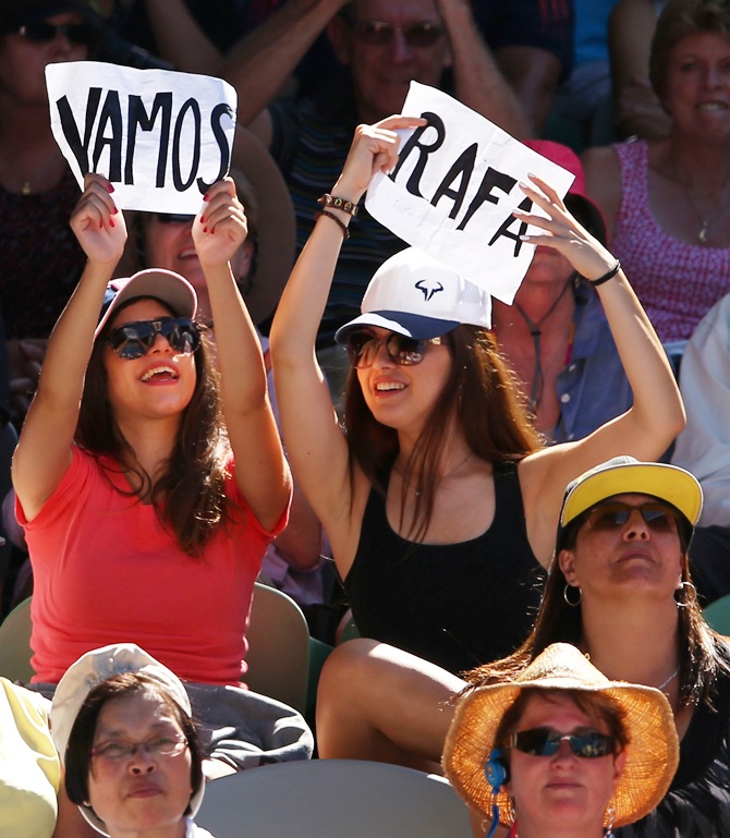 Rafael Nadal of Spain fans watch him