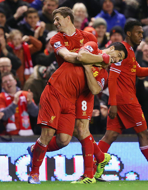 Steven Gerrard of Liverpool celebrates scoring the first goal with teammate Luis Suarez (right) during their English Premier League match against Sunderland at Anfield on Wednesday