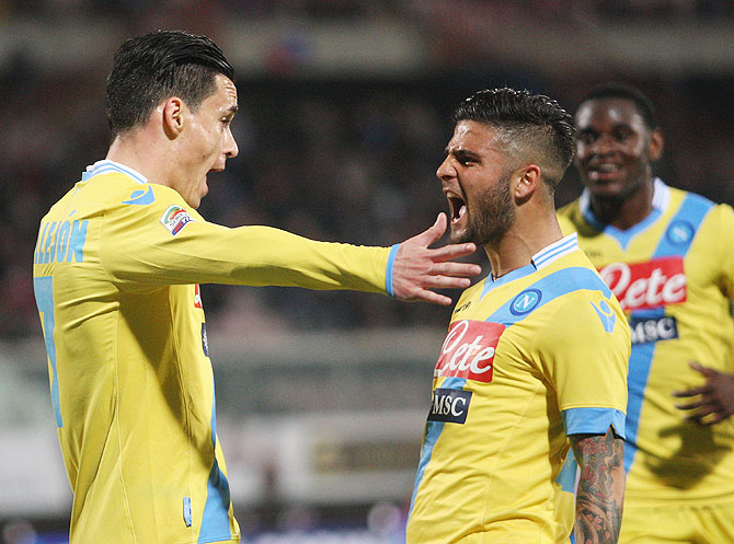 Jose Callejon (left) of Napoli celebrates the seocnd goal wth his teammate Lorenzo Insigne during the Serie A match against Calcio Catania at Stadio Angelo Massimino in Catania, Italy on Wednesday