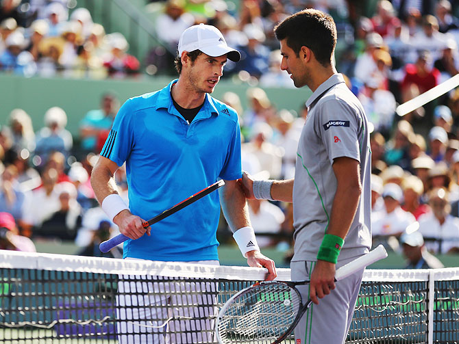 Andy Murray of Great Britain and Novak Djokovic of Serbia discuss the controversial point on Wednesday