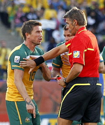 Aussie footballer Harry Kewell argues with a referee
