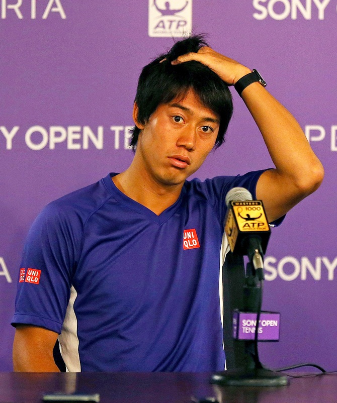 Kei Nishikori speaks at a press conference after withdrawing due to injury prior to his Semifinal match against Novak Djokovic of Serbia