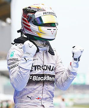 Lewis Hamilton of Great Britain and Mercedes GP celebrates victory after the Malaysia Formula One Grand Prix at the Sepang Circuit in Kuala Lumpur on Sunday