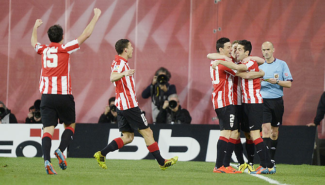 Athletic Bilbao players celebrate a goal by forward Iker Munain against Atletico Madrid on Saturday