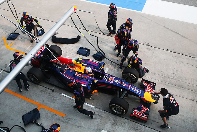 Daniel Ricciardo of Australia and Infiniti Red Bull Racing is pushed back into his pitbox during the Malaysia Formula One Grand Prix at the Sepang Circuit on Sunday