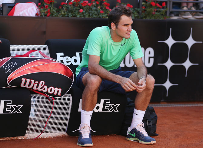 Roger Federer of Switzerland shows his dejection after a straight sets defeat