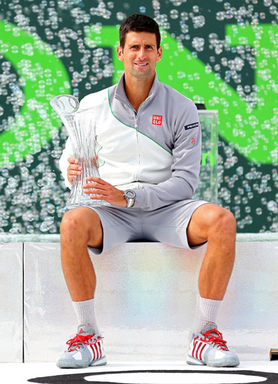 Novak Djokovic of Serbia holds the winner's trophy after winning the Sony Open at Crandon Park Tennis Center
