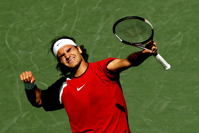 Roger Federer of Switzerland celebrates after winning