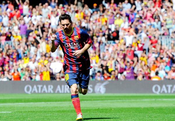 Lionel Messi celebrates after scoring the opening goal