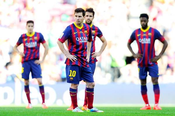 Lionel Messi (centre) and the Barcelona players shows their dejection after Angel Latifa scores Getafe's second goal