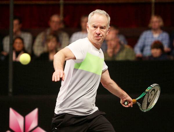 John McEnroe plays a forehand during the singles final against Mats Wilander of Sweden on Day Five of the Statoil Masters Tennis at the Royal Albert Hall on December 08, 2013 in London