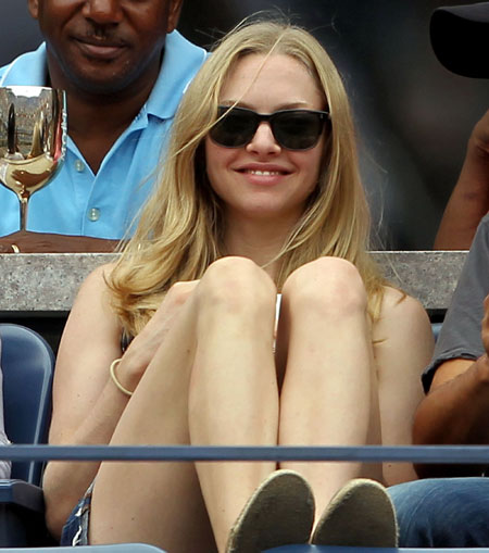 Actress Amanda Seyfried watches Anastasia Pavlyuchenkova of Russia play against Francesca Schiavone of Italy during the US Open