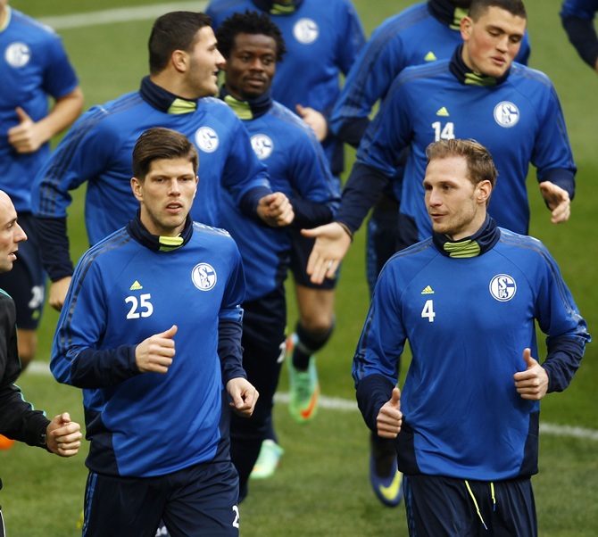 ewedes, right, warm up during a training session