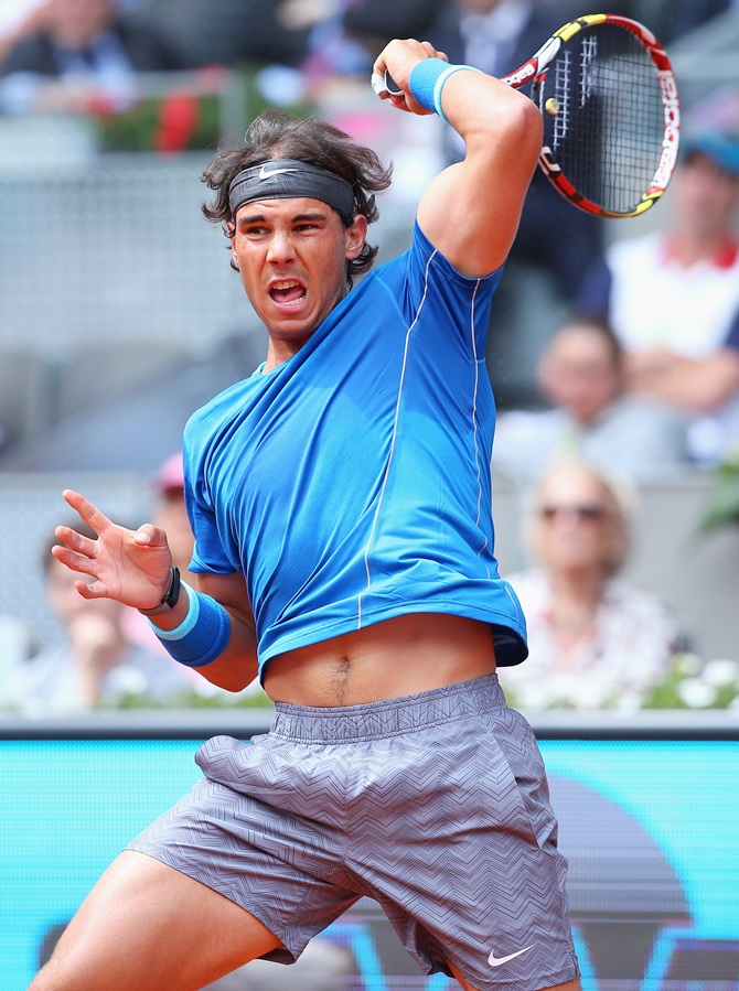 Rafael Nadal returns