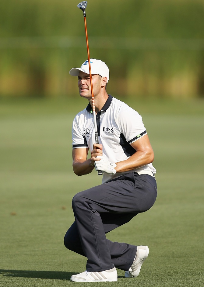 Martin Kaymer of Germany watches a shot on the ninth hole