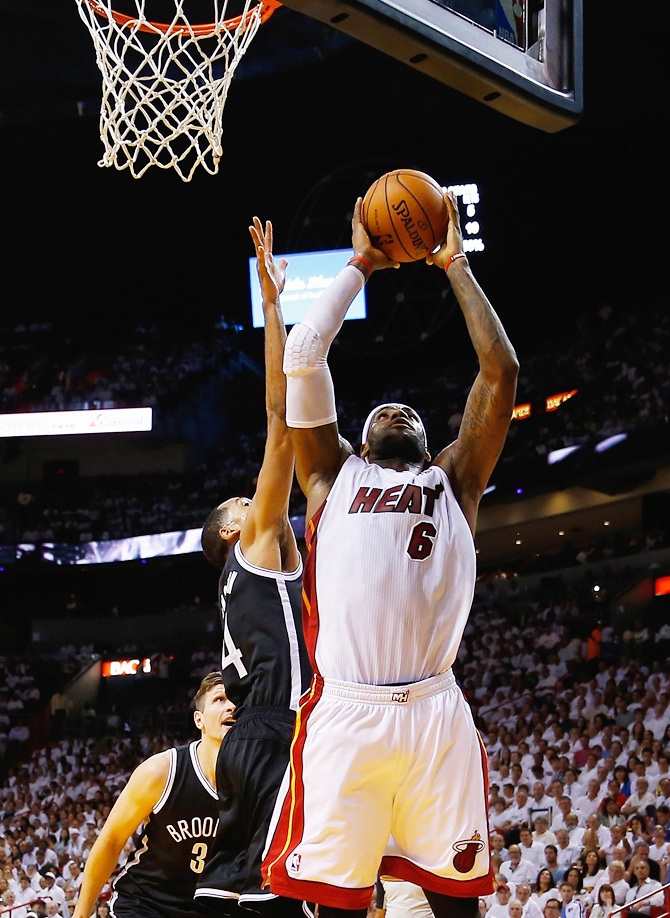 LeBron James (6) of the Miami Heat shoots over Shaun Livingston (14) of the Brooklyn Nets