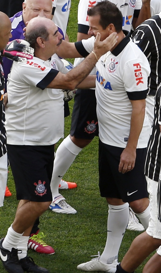 Rivelino,left, former soccer player from the Corinthians team celebrates with   Dunga, former national head coach