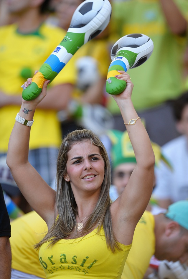 A Brazil fan enjoys the pre-match atmosphere; Neymar