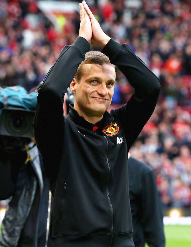 Nemanja Vidic of Manchester United salutes the crowd