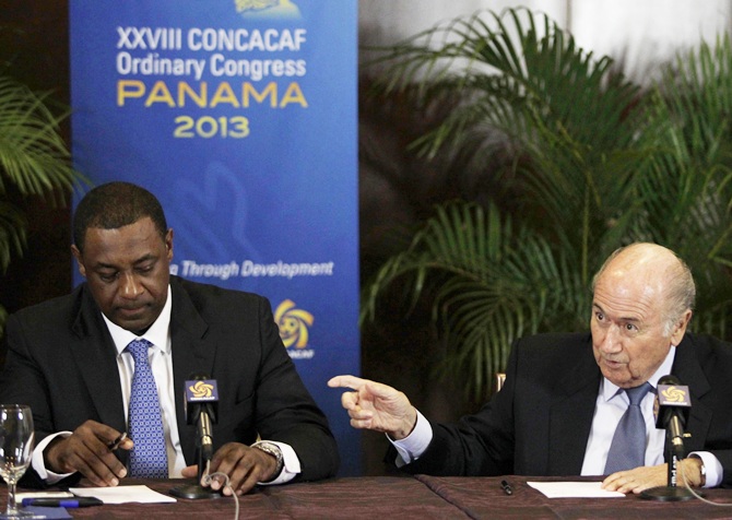 FIFA President Joseph Blatter,right, gestures next to CONCACAF President Jeffrey Webb