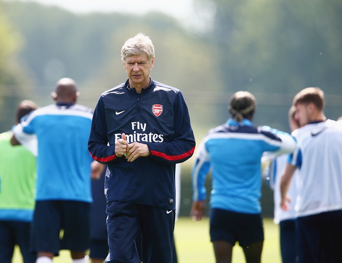 Arsene Wenger of Arsenal looks on during a training session